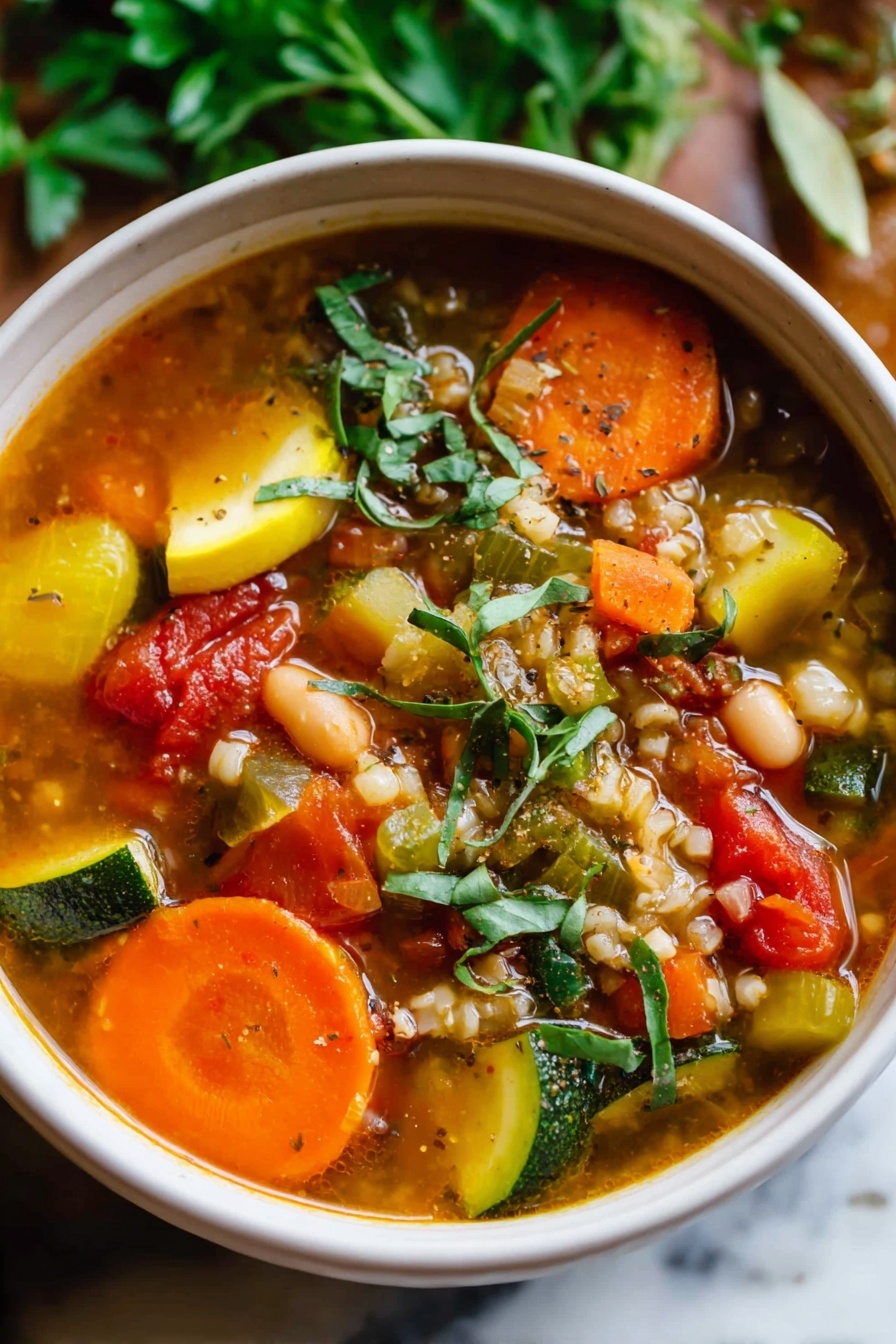 The image shows a close-up of a large silver spoon filled with a colorful stew. The stew has three main layers visible on the spoon: a layer of light green and dark green zucchini slices, a layer of round, bright orange carrot slices, and a layer of small, brown ground meat pieces mixed with white beans and diced red tomatoes. The stew is in a bowl with a white marbled surface background, and the broth appears slightly thick with a yellowish color and some herbs floating in it. photo taken with an iphone --ar 2:3 --v 7 - Turkey Vegetable Soup, healthy turkey vegetable soup, hearty vegetable soup with turkey, easy turkey vegetable soup, nutritious turkey soup