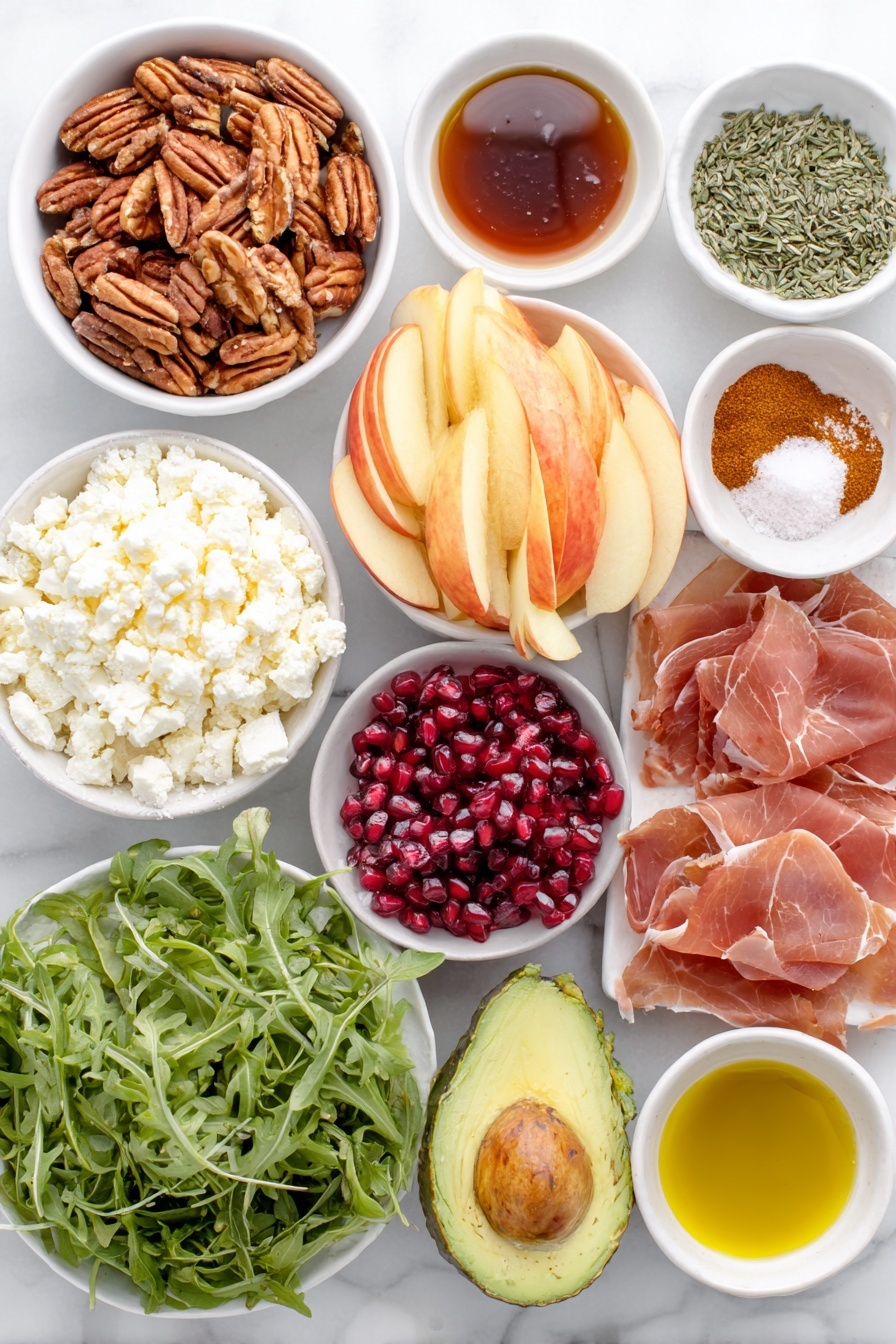 Flat lay of raw pecans, pumpkin seeds, small white bowl of maple syrup, small white bowl of cayenne pepper, small white bowl of ground cinnamon, flaky sea salt sprinkled in a small white dish, thinly sliced prosciutto laid neatly, fresh arugula leaves, thinly sliced honeycrisp apples arranged in a fan, diced ripe avocado, bright red pomegranate arils, crumbled feta cheese piled in a small white bowl, small white bowls of extra virgin olive oil, apple cider vinegar, Dijon mustard, apple butter, honey, fresh thyme leaves, chopped fresh sage, kosher salt and black pepper in small white bowls, all ingredients fresh and natural, balanced symmetrical layout placed on a clean white marble surface, soft natural light, photo taken with an iPhone, professional food photography style, fresh ingredients, white ceramic bowls, no bottles, no duplicates, no utensils, no packaging --ar 2:3 --v 7 --p awthu7i m7354615311229779997 - Autumn Harvest Honeycrisp Apple and Feta Salad, fall apple salad recipes, honeycrisp apple salad, easy autumn salad, seasonal apple salad