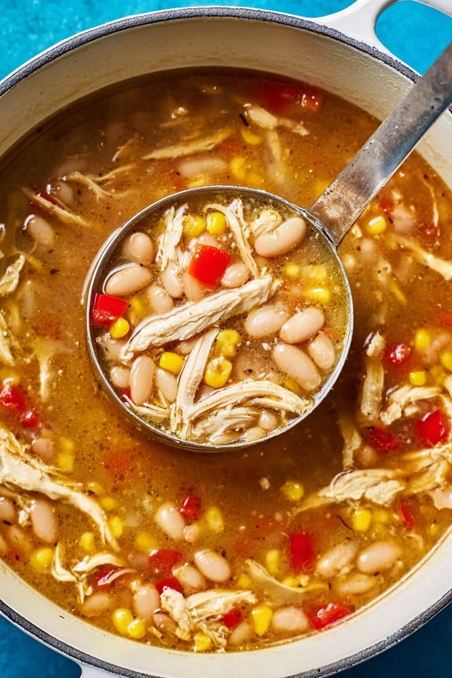 The image shows a white pot filled with a thick soup made of shredded white chicken, white beans, yellow corn kernels, and small red bell pepper pieces. The soup broth is brown and slightly shiny, looking warm and rich. A metal ladle is scooping a portion of the soup, lifting it just over the surface, showing a dense mix of chicken, beans, corn, and red peppers. The pot sits on a bright blue surface, contrasting with the white pot and the colorful soup inside. Photo taken with an iphone --ar 2:3 --v 7 - White Bean Chicken Chili, white bean chicken chili recipe, easy white bean chili, healthy chicken chili, comforting winter chili