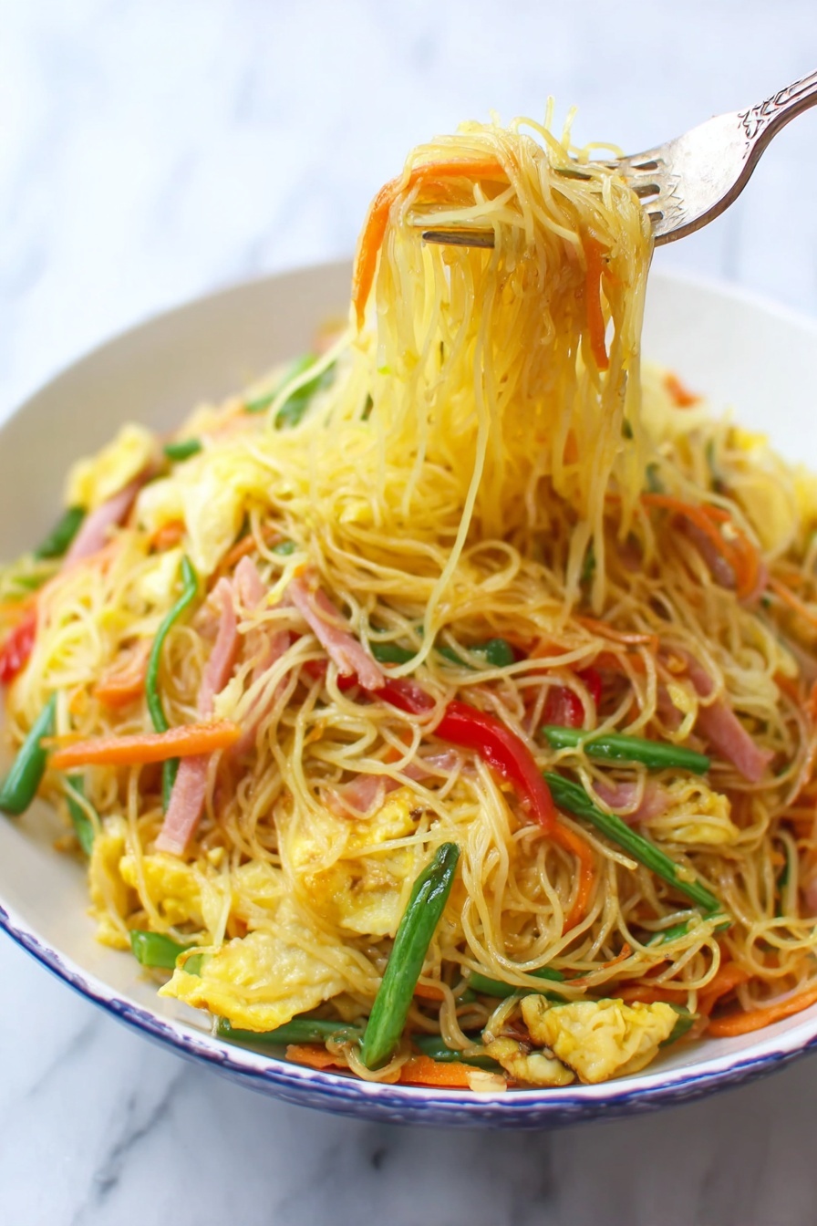 A white bowl filled with thin yellow noodles mixed with bright orange carrot strips, light green beans, red bell pepper slices, and small pieces of scrambled egg, all stirred together with thin strips of ham that have a light pink color. A fork lifts a bundle of noodles from the bowl, showing the textured and slightly oily surface of the noodles. The background is a white marbled surface. photo taken with an iphone --ar 2:3 --v 7 - Singapore Rice Noodles, Singapore Rice Noodles recipe, easy Asian noodle stir-fry, flavorful shrimp and pork noodles, quick Southeast Asian dinner