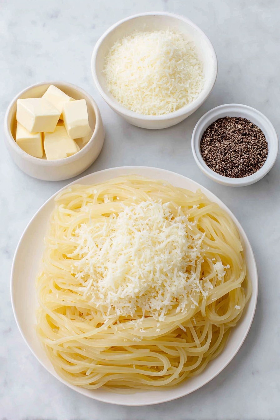 Flat lay of dried bucatini pasta nest, two tablespoons of unsalted butter in a small white ceramic bowl, half cup of freshly grated Pecorino Romano cheese in a simple white plate, cracked black peppercorns scattered neatly beside a small white bowl containing toasted cracked black pepper, placed on a clean white marble surface, soft natural light, photo taken with an iPhone, professional food photography style, fresh ingredients, white ceramic bowls, no bottles, no duplicates, no utensils, no packaging --ar 2:3 --v 7 --p m7354615311229779997 - Creamy Cacio e Pepe Pasta, how to make Cacio e Pepe, easy Italian pasta recipes, quick creamy pasta dishes, traditional Roman pasta