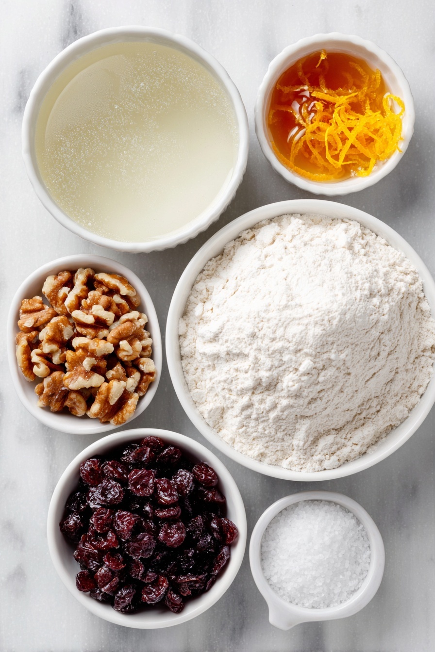 Flat lay of a small mound of fine white bread flour, a small white ceramic bowl of warm water shimmering gently, a small white ceramic bowl with golden honey, a few rough chunks of dried cranberries, roughly chopped pieces of fresh walnuts, a small white ceramic bowl of granulated sugar, a small white ceramic bowl of coarse kosher salt, bright fresh orange zest curls, a small mound of active dry yeast granules, all arranged in perfect symmetry on a clean white marble surface, soft natural light, photo taken with an iPhone, professional food photography style, fresh ingredients, white ceramic bowls, no bottles, no duplicates, no utensils, no packaging --ar 2:3 --v 7 --p m7354615311229779997 - No-Knead Cranberry Walnut Bread, cranberry walnut bread, holiday bread recipes, easy homemade bread, festive bread with cranberries and walnuts