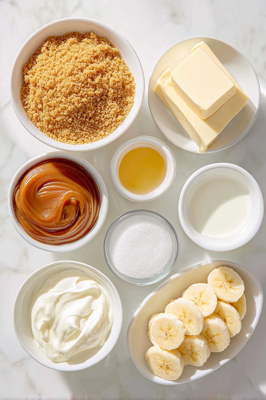 Flat lay of finely crushed golden-brown graham cracker crumbs in a simple white ceramic bowl, a small white bowl of granulated sugar sparkling under natural light, a small white bowl holding melted golden unsalted butter, a small white bowl filled with smooth, glossy caramel-colored dulce de leche, two fresh ripe bananas sliced into neat, even rounds arranged in a small pile, a small white bowl of cold heavy cream, a small white bowl of fine confectioners’ sugar sparkling softly, and a small white bowl containing clear, pale vanilla extract, all arranged in perfect symmetry and balanced proportions, placed on a clean white marble surface, soft natural light, photo taken with an iPhone, professional food photography style, fresh ingredients, white ceramic bowls, no bottles, no duplicates, no utensils, no packaging --ar 2:3 --v 7 --p m7354615311229779997 - Decadent Banoffee Pie with Dulce de Leche, Banoffee Pie with Dulce de Leche, easy banoffee pie recipe, homemade banoffee dessert, creamy caramel banana pie