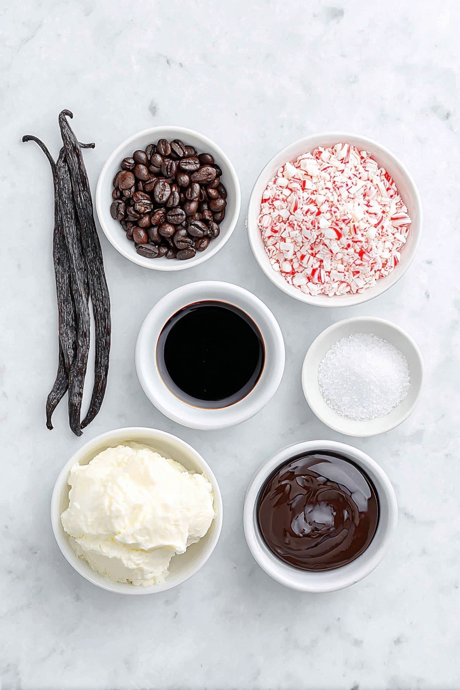Flat lay of fresh whole vanilla bean pod, two glossy dark roasted espresso beans, a small white ceramic bowl of rich black espresso, a small white ceramic bowl with creamy half & half, a small white ceramic bowl of smooth dark coffee liqueur, a small white ceramic bowl of clear peppermint extract, a small white ceramic bowl filled with crushed red and white candy cane pieces, and a small white ceramic bowl of glossy chocolate syrup, all arranged in perfect symmetry, placed on a clean white marble surface, soft natural light, photo taken with an iPhone, professional food photography style, fresh ingredients, white ceramic bowls, no bottles, no duplicates, no utensils, no packaging --ar 2:3 --v 7 --p m7354615311229779997 - Peppermint Espresso Martini, festive holiday cocktails, peppermint martini, holiday cocktail recipes, winter drinks with peppermint