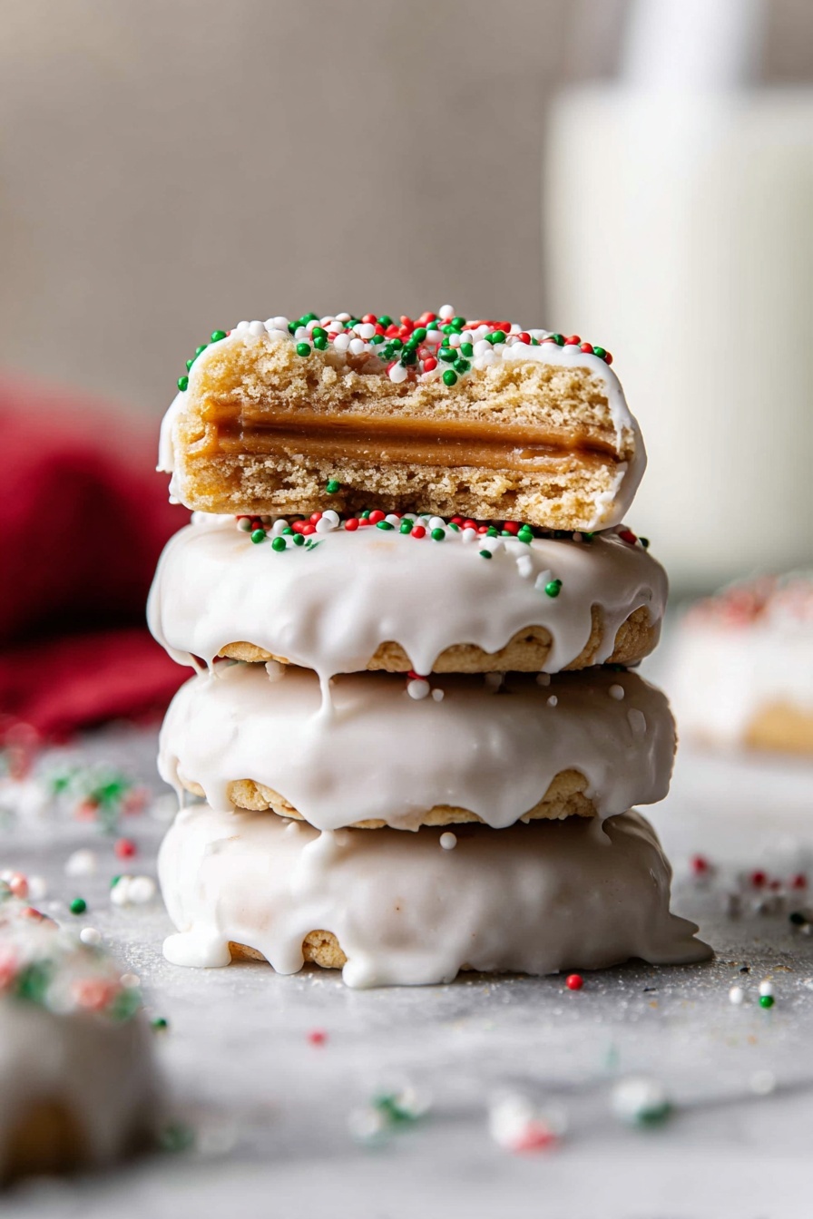 A stack of four round cookies covered in white icing sits on a white marbled surface, with some red, green, and white sprinkles scattered around. The top cookie is bitten in half, showing three layers inside: a crispy pale brown outer cookie layer, a smooth light brown filling in the middle, and the white icing on top. The white icing drips slightly down the sides of the other whole cookies below, creating a soft, glossy texture. The background is softly blurred with a large glass of milk in the back. Photo taken with an iphone --ar 2:3 --v 7 - Ritz Cracker Peanut Butter Cookies, easy salty-sweet cookies, no-bake peanut butter cookies, homemade sandwich cookies, quick holiday treats