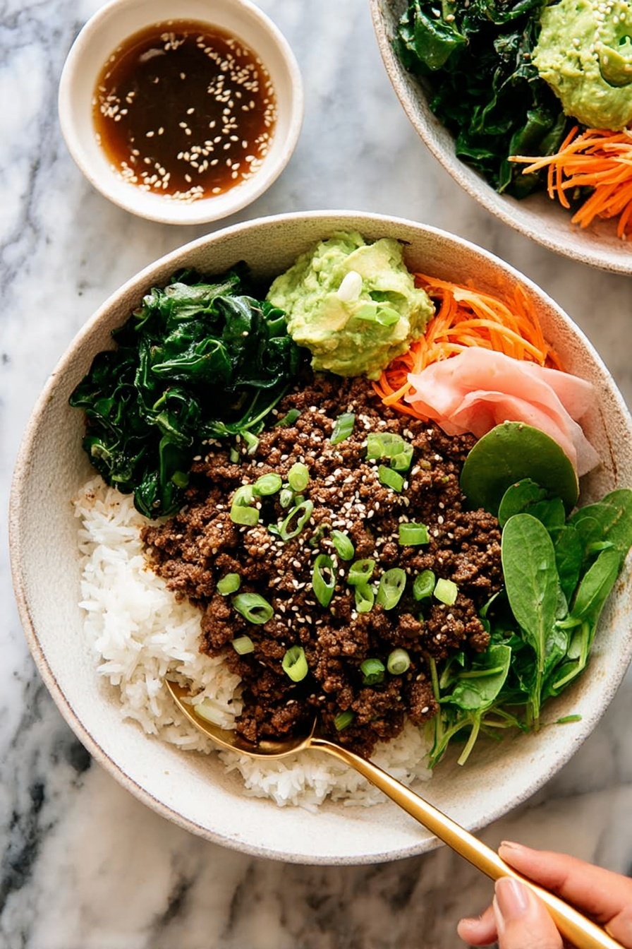 The dish is served in a white bowl filled with three main layers: at the bottom is a bed of white rice mixed with small green vegetables and thin orange carrot strips, on top is a layer of crumbly cooked brown ground meat, and on one side there are fresh green leafy lettuce and soft pink pickled ginger slices. In the center of the bowl, a small dollop of green mashed avocado is sprinkled with white sesame seeds and chopped green onions. A gold spoon rests inside the bowl against the edge, and the bowl sits on a white marbled surface next to a white cloth napkin. Photo taken with an iphone --ar 2:3 --v 7 - Korean Beef Bulgogi Rice Bowls, Korean beef bowl, Bulgogi rice bowl recipe, easy Korean beef recipe, quick dinner bowls