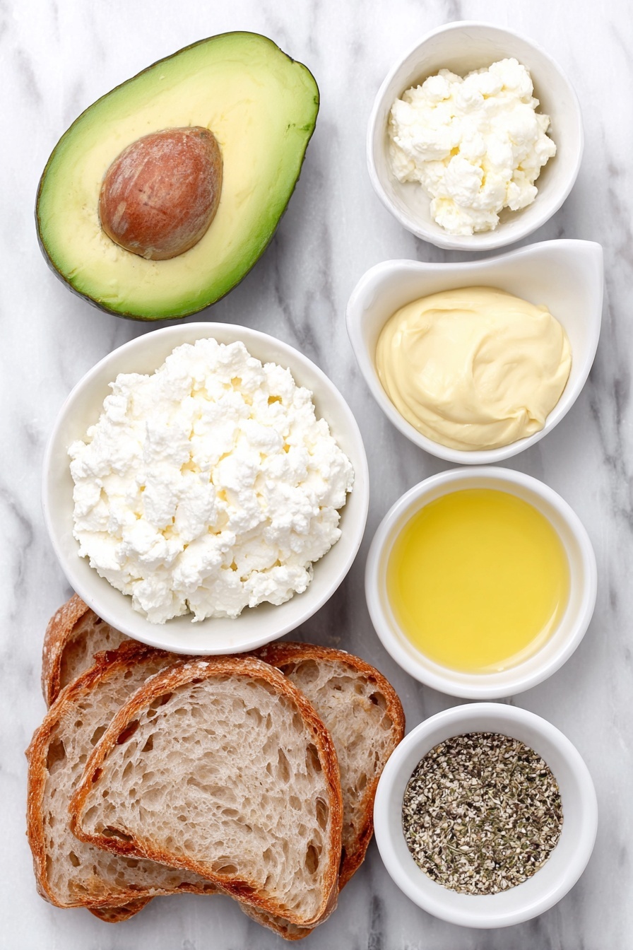 Flat lay of a halved ripe avocado with its pit removed, a small white ceramic bowl filled with creamy cottage cheese, a small white bowl containing fresh lemon juice, a small white bowl holding Dijon mustard, a small white bowl with golden honey, a small white bowl with mixed Everything but the Bagel seasoning, and two slices of rustic sourdough bread arranged symmetrically, all placed on a clean white marble surface, soft natural light, photo taken with an iPhone, professional food photography style, fresh ingredients, white ceramic bowls, no bottles, no duplicates, no utensils, no packaging --ar 2:3 --v 7 --p m7354615311229779997 - Creamy Cottage Cheese Avocado Toast, healthy breakfast ideas, easy avocado toast, quick snack recipes, protein-packed breakfast