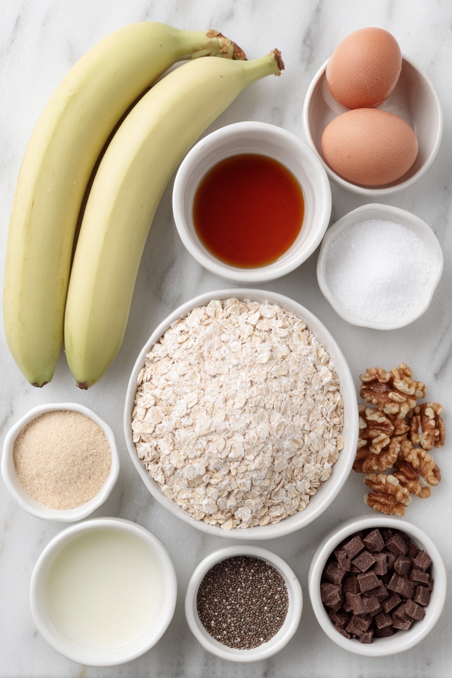 Flat lay of two large extra ripe bananas, a small heap of natural peanut butter, a small white bowl of pure maple syrup, one whole large egg with a clean shell, a small white bowl of pure vanilla extract, a small mound of oat flour, a small pile of golden flaxseed meal, a tiny sprinkle of ground cinnamon, a pinch of baking soda powder, a pinch of kosher salt, a small pile of old fashioned rolled oats, a few tablespoons of hemp hearts, a small spoonful of chia seeds, a small pile of semi-sweet chocolate chips, a small handful of chopped walnuts, and a few flakes of flaky sea salt, all arranged symmetrically around and inside simple white ceramic bowls, placed on a clean white marble surface, soft natural light, photo taken with an iPhone, professional food photography style, fresh ingredients, white ceramic bowls, no bottles, no duplicates, no utensils, no packaging --ar 2:3 --v 7 --p m7354615311229779997 - Healthy Banana Breakfast Cookies, nutritious morning cookies, easy healthy breakfast recipes, vegan breakfast cookies, quick banana cookies