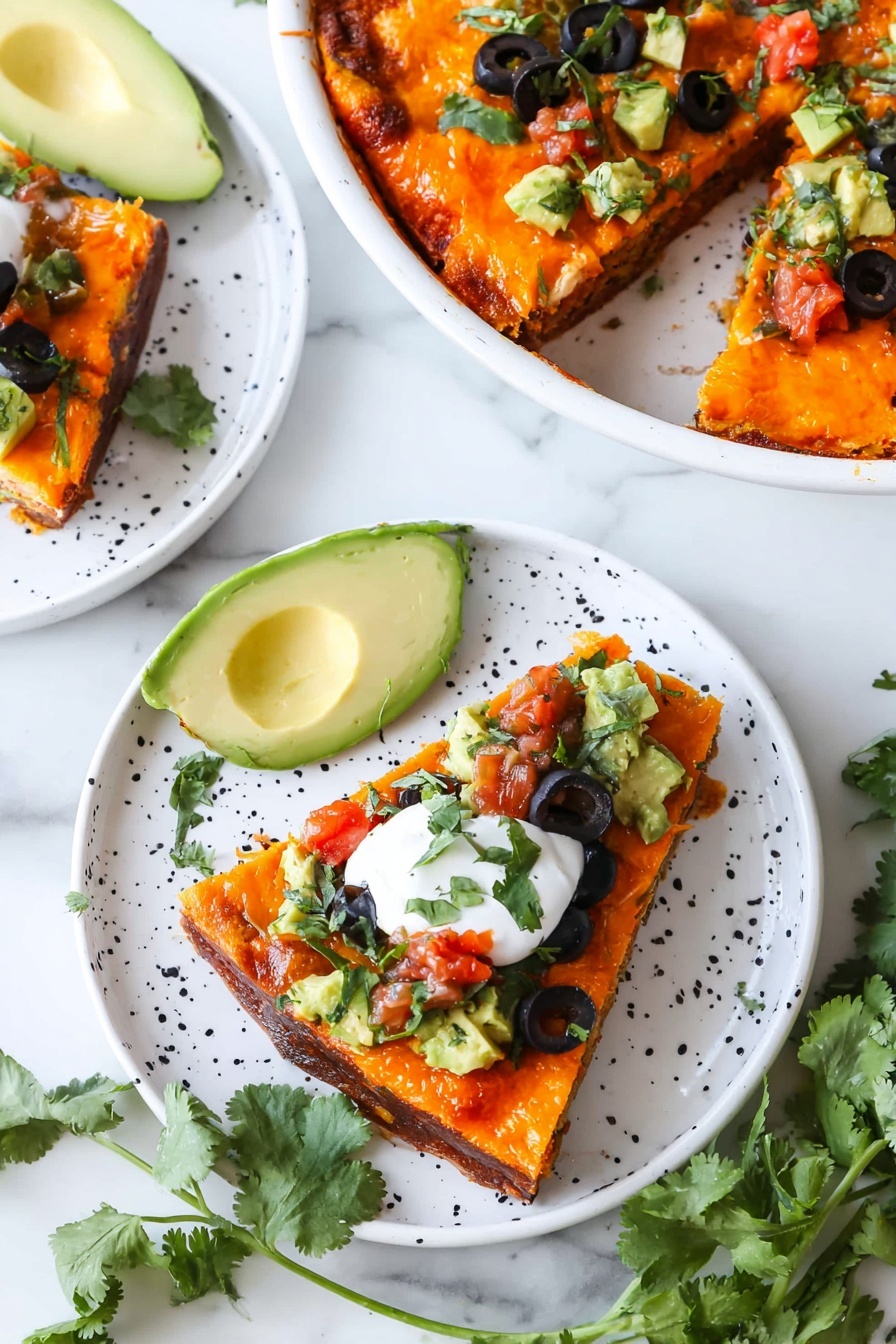 A slice of layered casserole sits on a white plate with a white marbled surface underneath. The bottom layer is thick and brown, looking like ground meat or beans, topped by a smooth, bright orange layer of melted cheese. On top of the cheese, there are small cubes of green avocado and a dollop of white sour cream, sprinkled with fresh green cilantro leaves and black olive slices scattered around the plate and on the slice. In the background, more slices and a glass pie dish with the casserole are slightly blurred. Photo taken with an iphone --ar 2:3 --v 7 - Keto Crustless Taco Pie, low-carb taco casserole, keto taco bake, gluten-free taco pie, keto dinner ideas